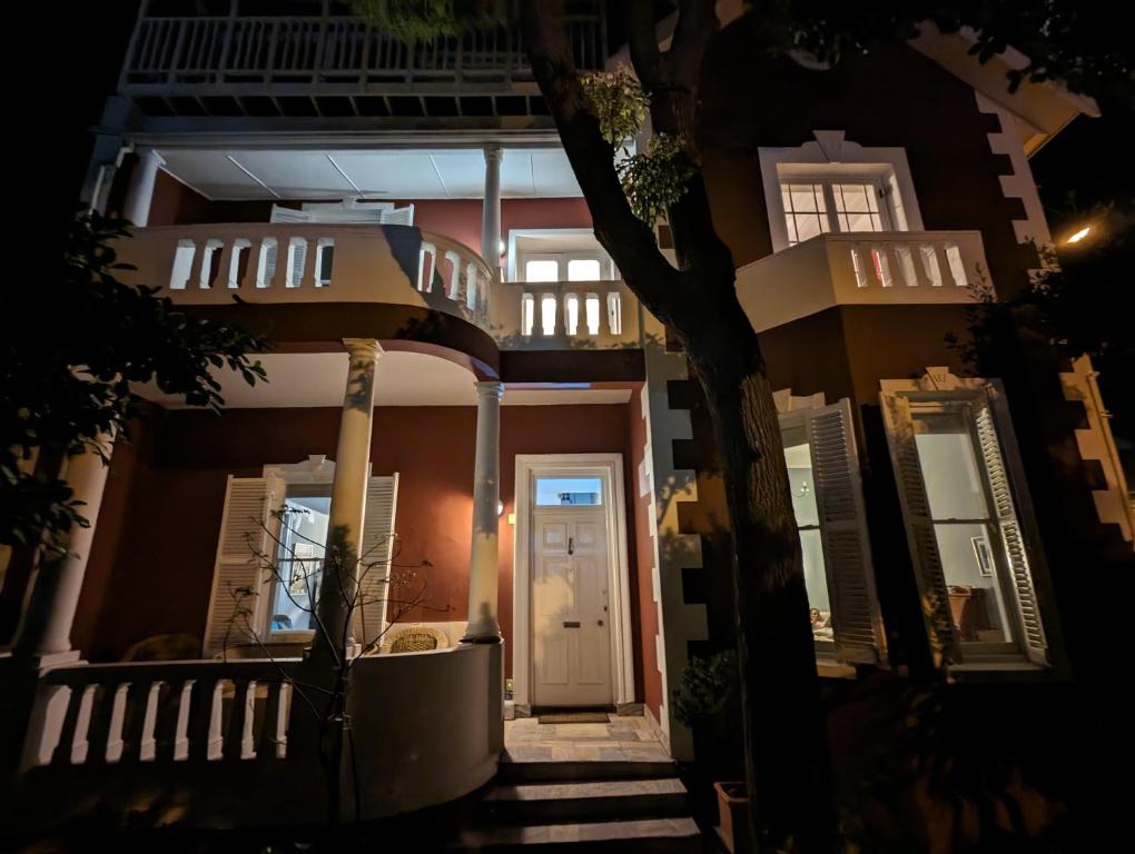 a house at night with a white door and stairs at La Montagne Observatory in Cape Town