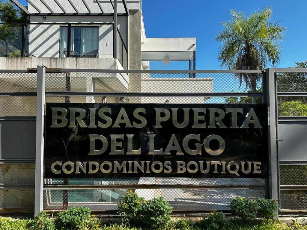 a sign for a del lagoria condominatio boutique at Puerta del Lago in San Bernardino