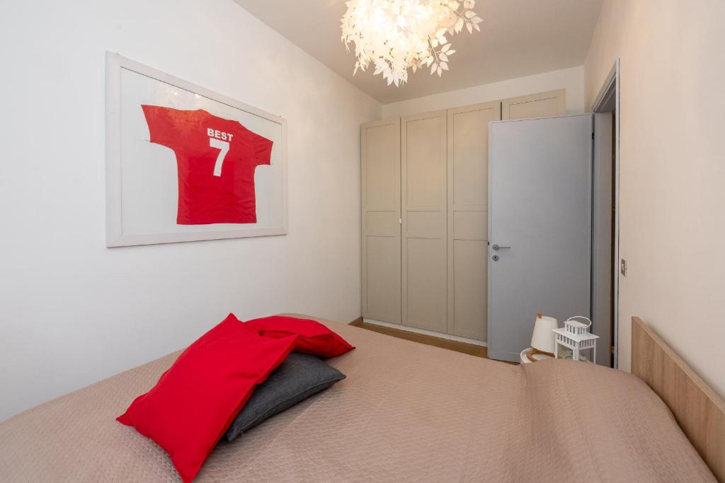 Ένα ή περισσότερα κρεβάτια σε δωμάτιο στο Appartamento Best Forcellini