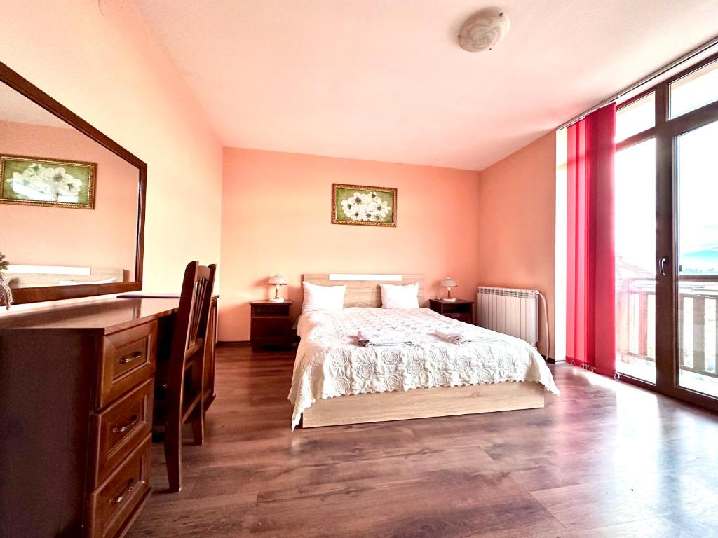 Postel nebo postele na pokoji v ubytování Family Hotel Carpe Diem