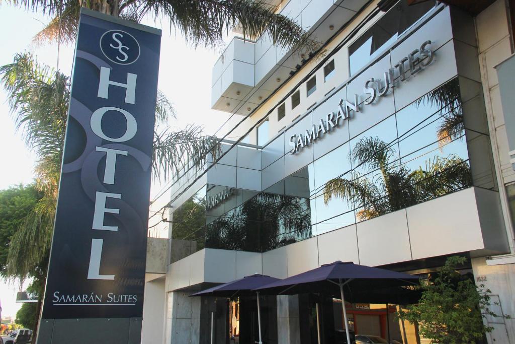 a building with a sign in front of it at SAMARÁN SUITES in Villa María