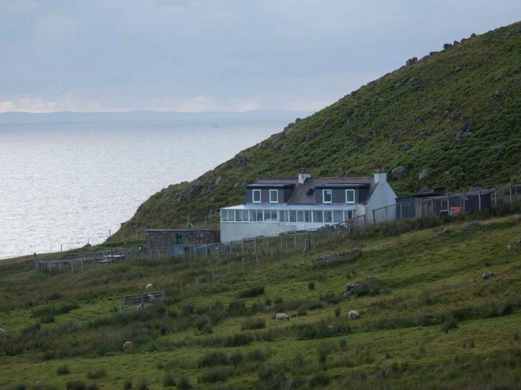 a house on top of a hill next to the ocean at Uk7471 - Otterburn 1 in Aultgrishin
