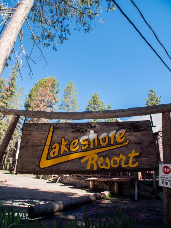 a sign for aestyle resort at a park at Lakeshore Resort in Lakeshore