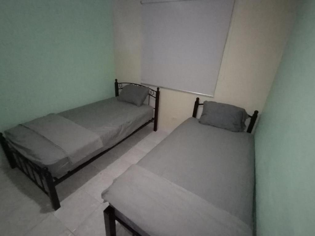 Postel nebo postele na pokoji v ubytování La Casa Buena Esperanza