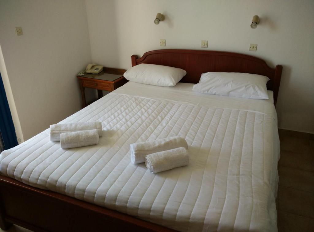 Postel nebo postele na pokoji v ubytování Miros Hotel Apartments