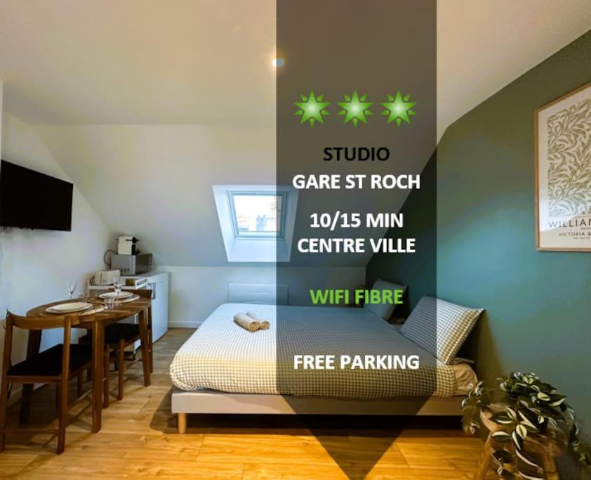 a bedroom with a bed and a dining room with a table at L'Esprit Vert Rivage ~Gare St ROCH ~FREE Parking in Amiens
