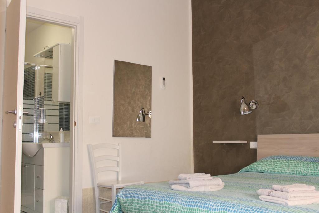 A bed or beds in a room at Alghero Budget