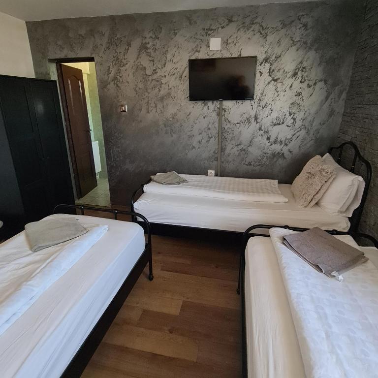 Postel nebo postele na pokoji v ubytování Vila Estera Therme Balotesti