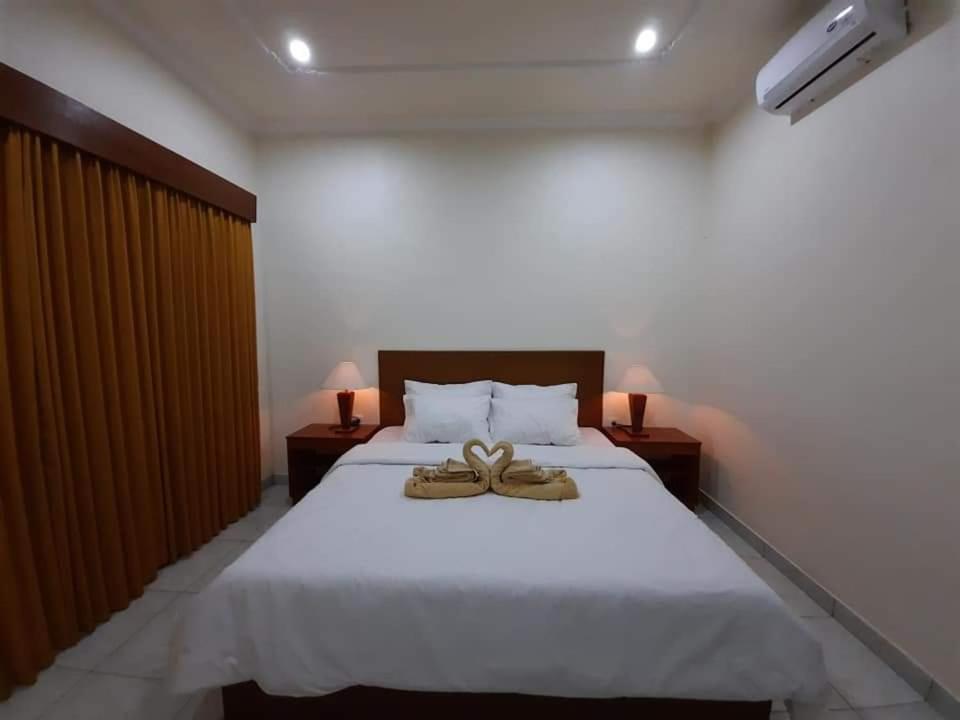 Postel nebo postele na pokoji v ubytování Guest House Sudara