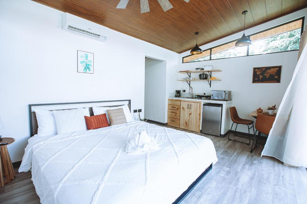 Postel nebo postele na pokoji v ubytování Natura Bungalows