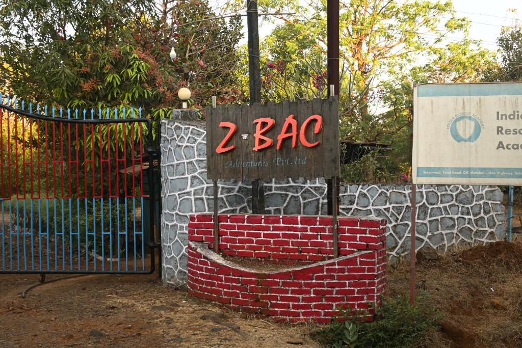 a sign that reads abc in front of a gate at Z-Bac Adventure & Leisure Resort Kolad in Kolād