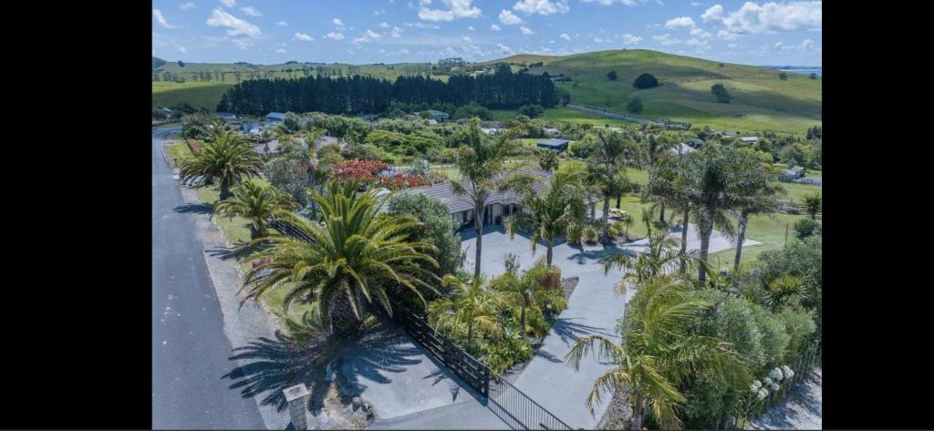 an aerial view of a resort with palm trees at Taipa Views Bed & Breakfast in Kaitaia