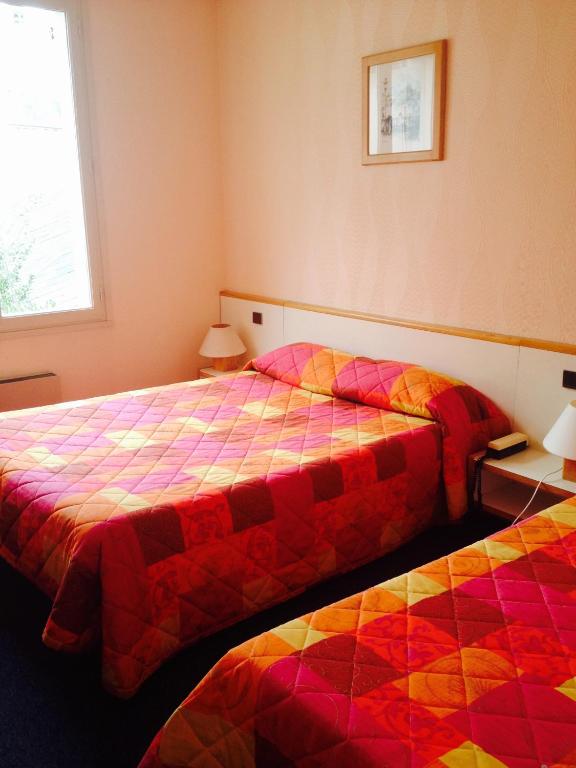 Postel nebo postele na pokoji v ubytování Jackotel