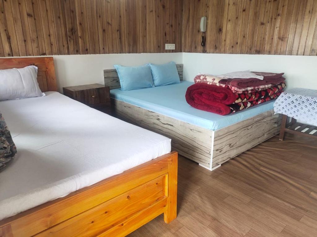 Voodi või voodid majutusasutuse Boho Homestay, Rangbhang toas