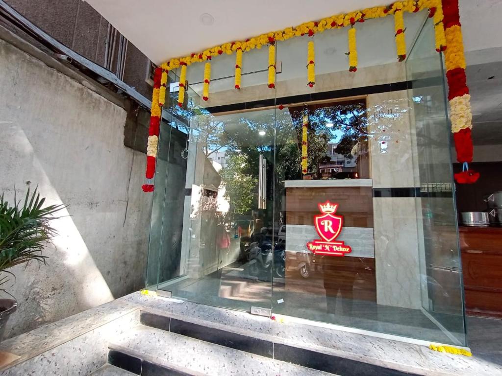 a store front with a sign in the window at Royal N Deluxe in Bangalore