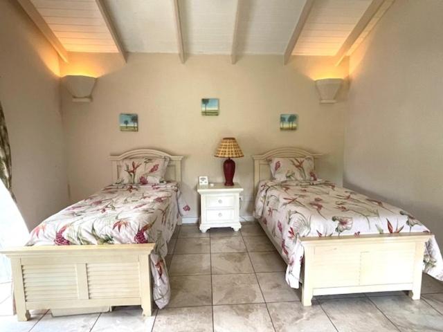 Кровать или кровати в номере Villa Ashiana - Beautiful 3-bedroom villa in Marigot Bay villa