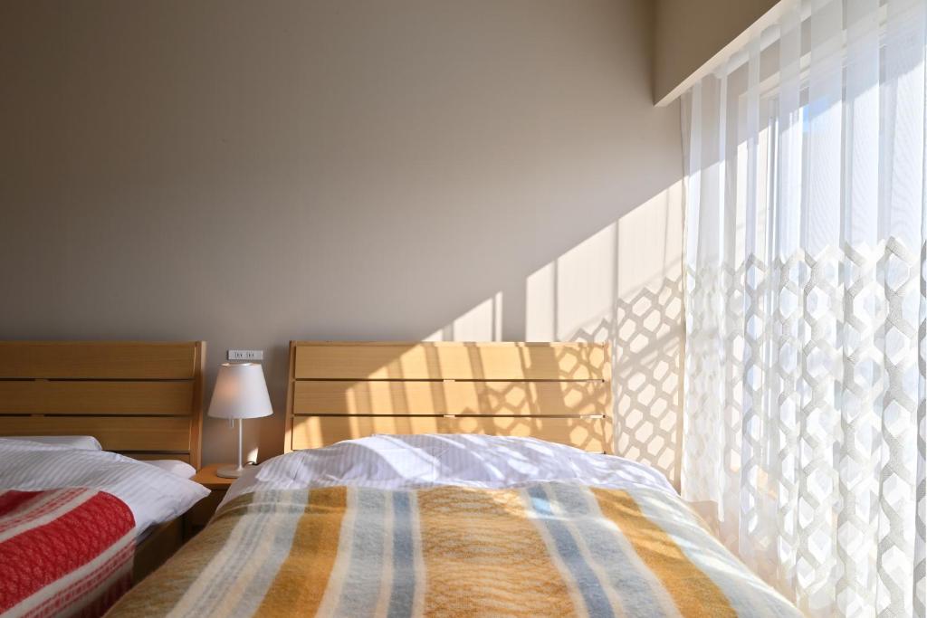 Postel nebo postele na pokoji v ubytování ROOM design hotel