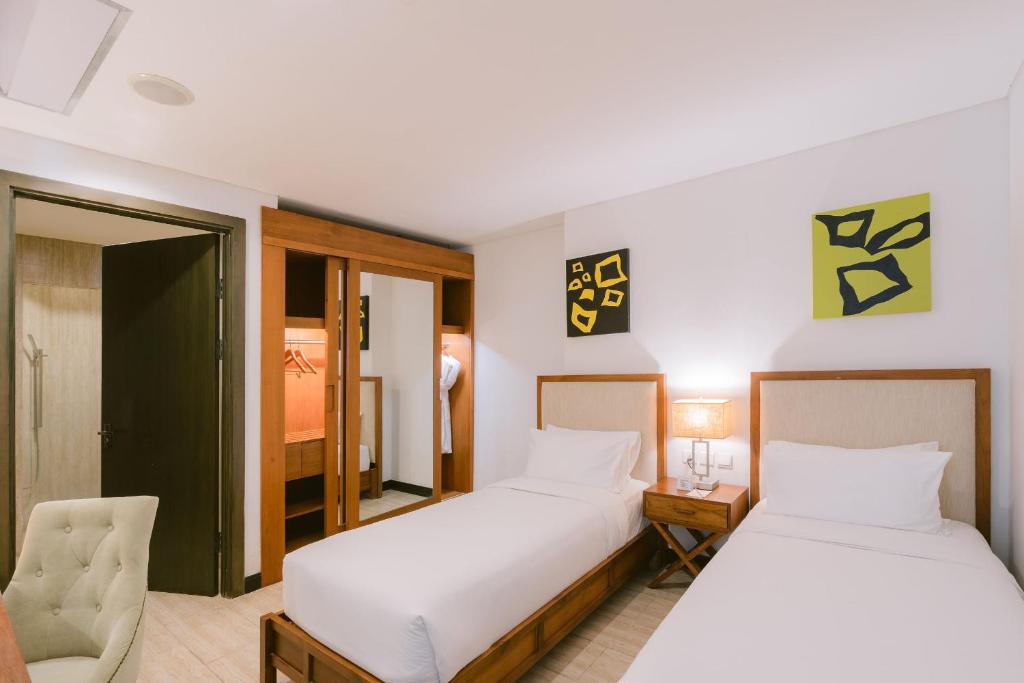 Postel nebo postele na pokoji v ubytování Lv8 Resort Hotel