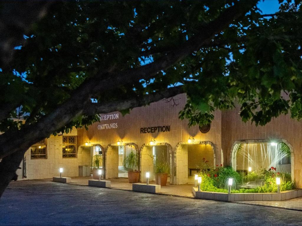 a store front of a building at night at Kuruman Lodge in Kuruman