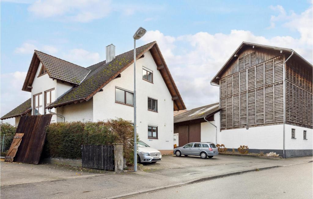 a large white house with a gambrel roof at Amazing Apartment In Kehl-bodersweier With Wifi 