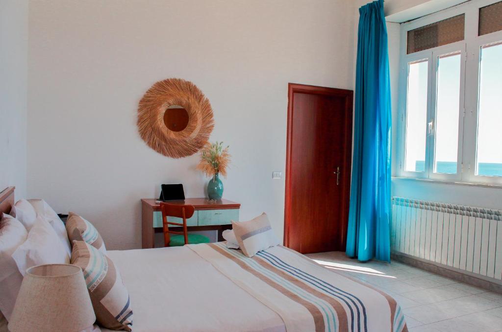 Postel nebo postele na pokoji v ubytování Villa MG Hotel