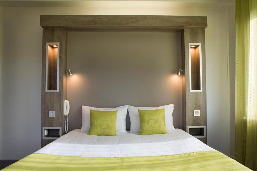 Postel nebo postele na pokoji v ubytování Hotel Les Mésanges