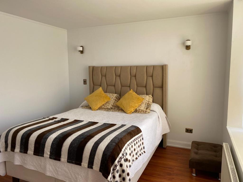 Tempat tidur dalam kamar di Apart suite san Miguel vips