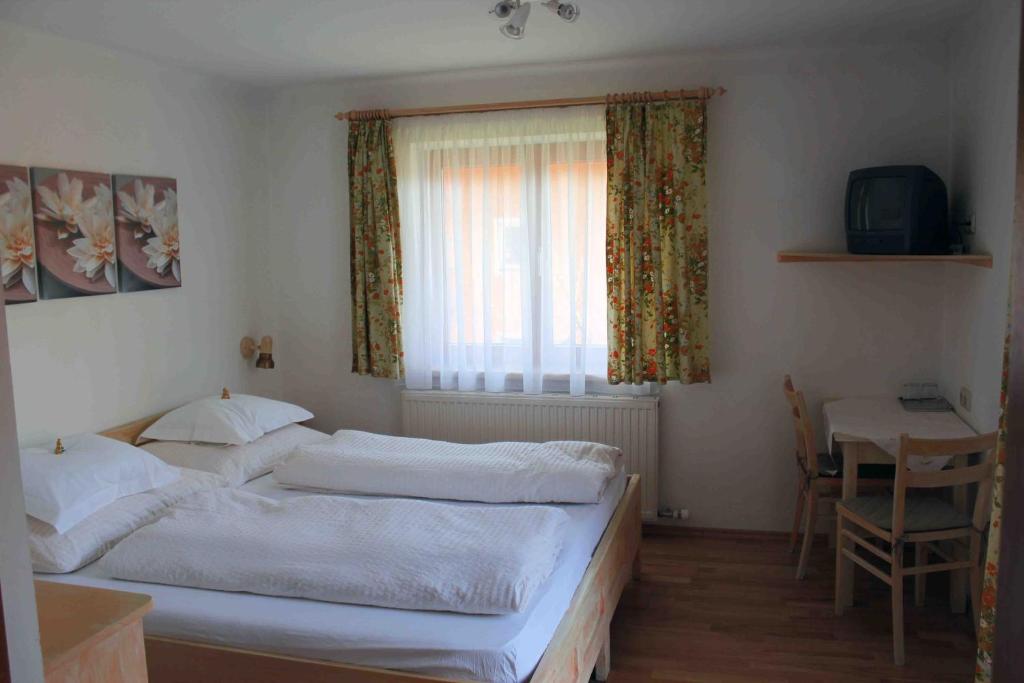 Posteľ alebo postele v izbe v ubytovaní Haus Senoner