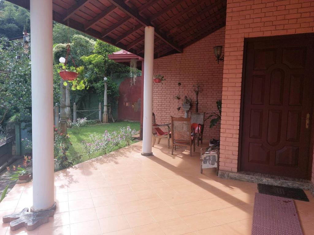 a front door of a house with a patio at Mystique Hideout in Kandy