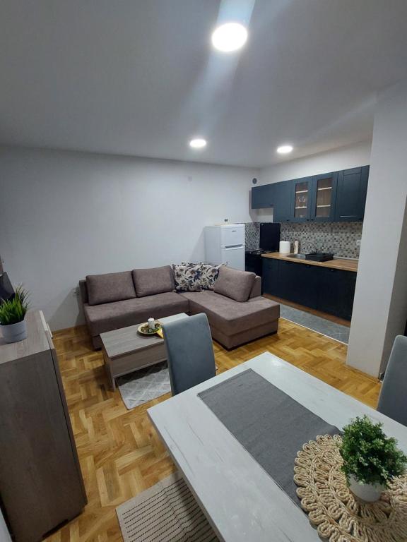 a living room with a couch and a table at Cista DESETKA 2 in Požarevac