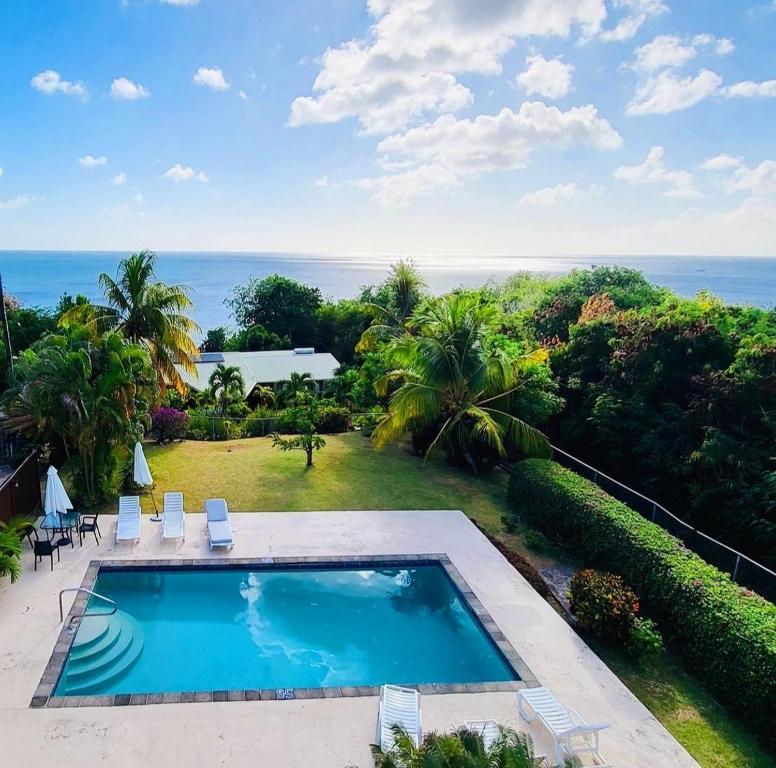 A view of the pool at The Date House - Four Bedroom Villa with Private Pool near the beach and Calabash Cove Resort villa or nearby