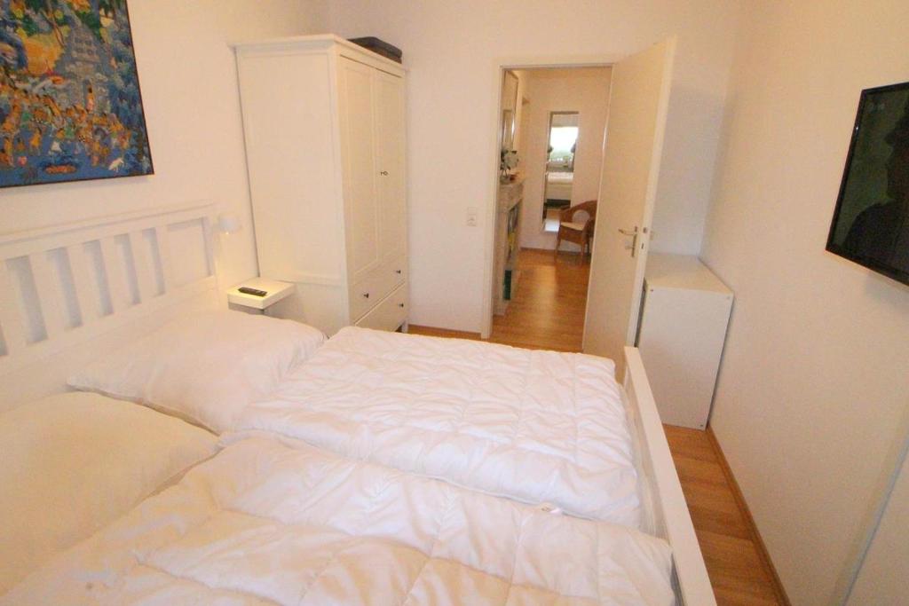 Postel nebo postele na pokoji v ubytování Apartmentvermittlung Mehr als Meer - Objekt 11