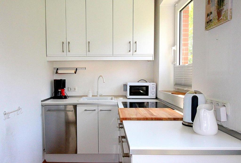 Kuchyň nebo kuchyňský kout v ubytování Apartmentvermittlung Mehr als Meer - Objekt 11
