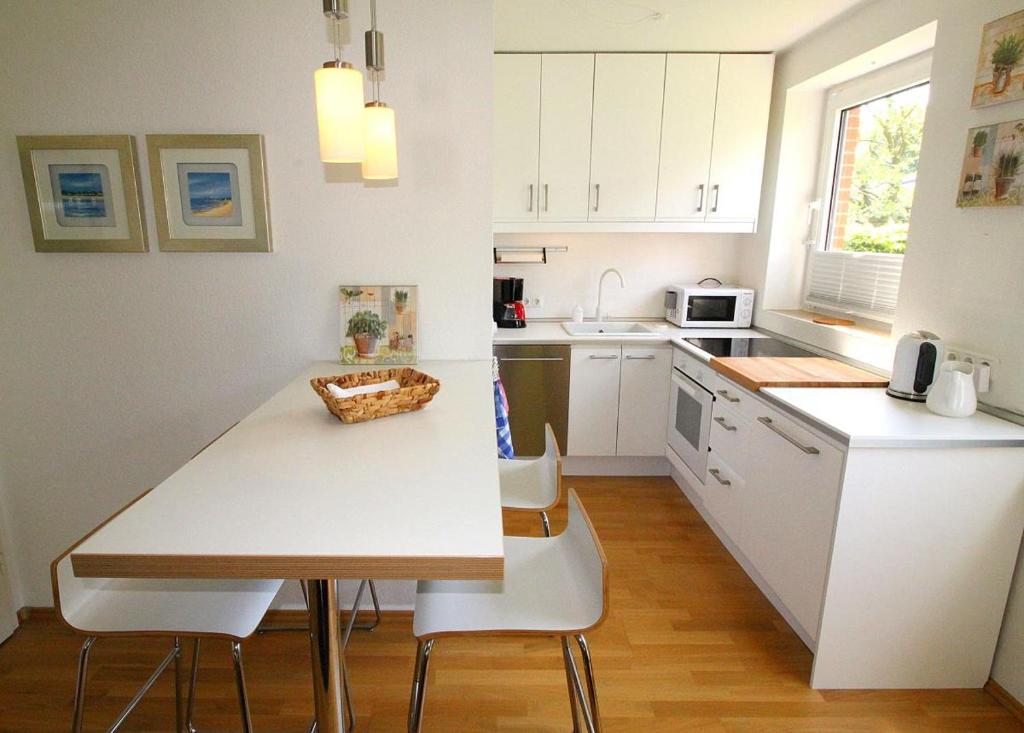 Kuchyň nebo kuchyňský kout v ubytování Apartmentvermittlung Mehr als Meer - Objekt 11
