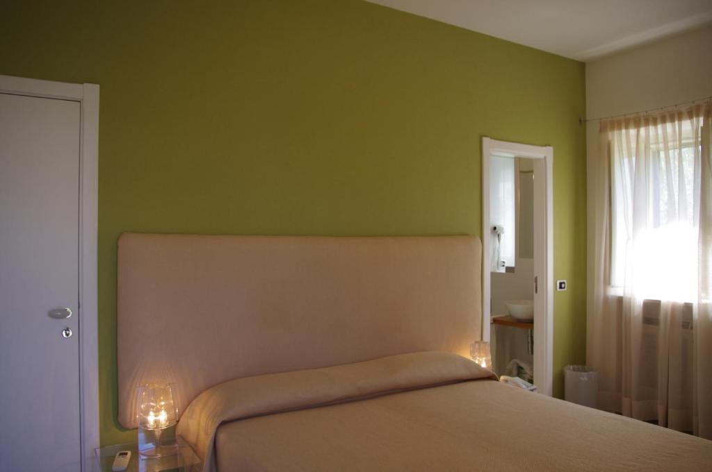 Postel nebo postele na pokoji v ubytování La Piccola Locanda