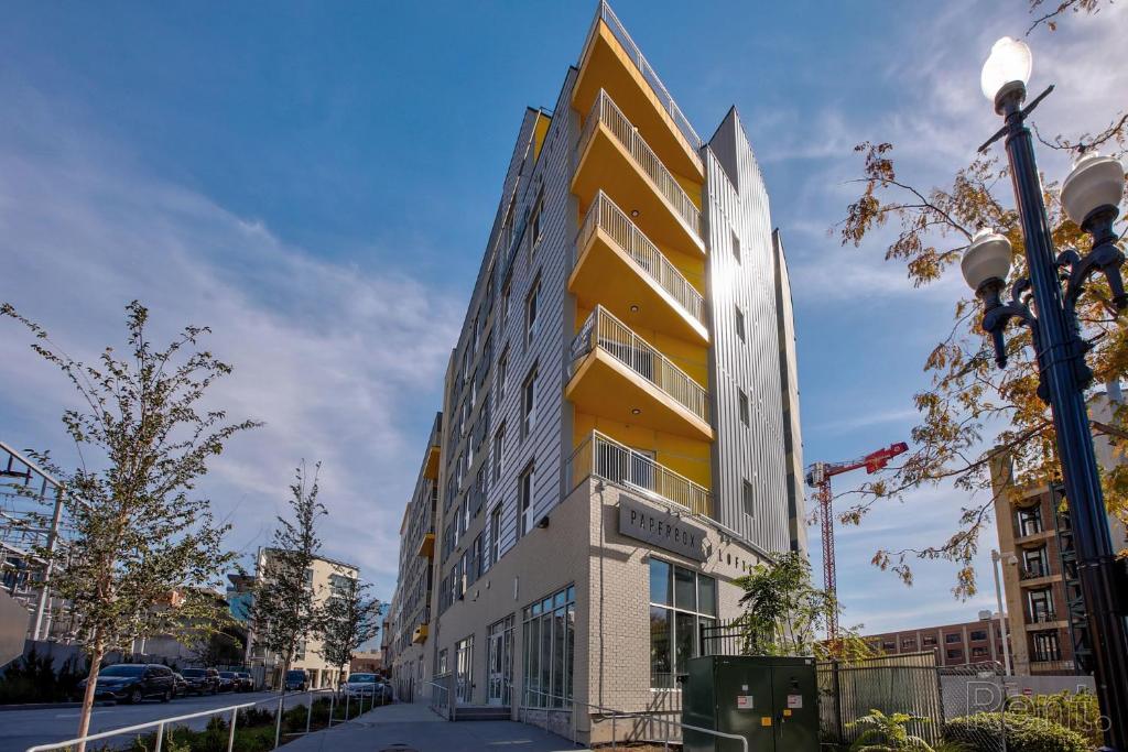 a yellow and white building on a city street at Premium Spacious Apartments at Paperbox Lofts in Salt Lake City in Salt Lake City