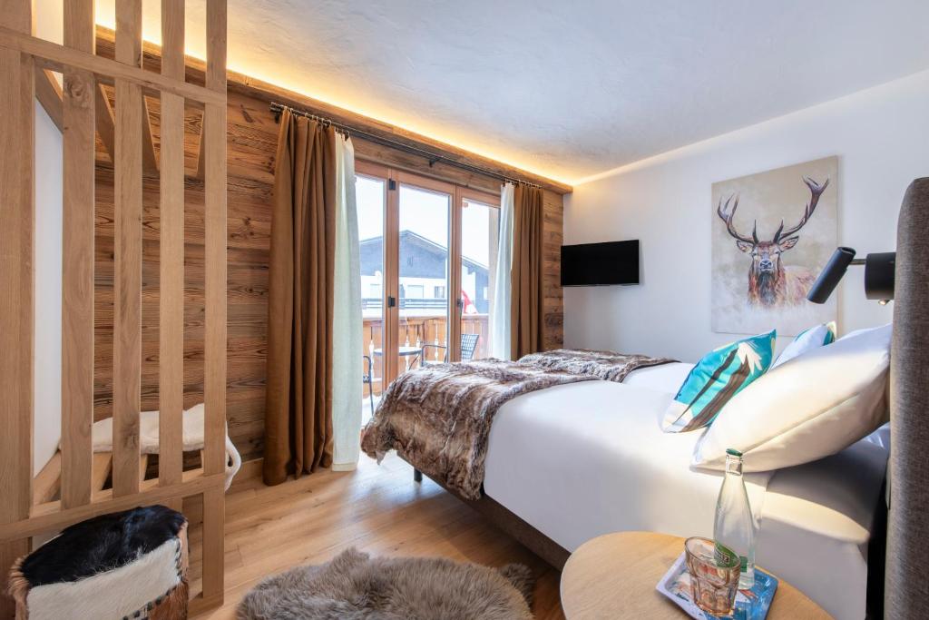 Postel nebo postele na pokoji v ubytování PAPILL'ON - Boutique Hotel