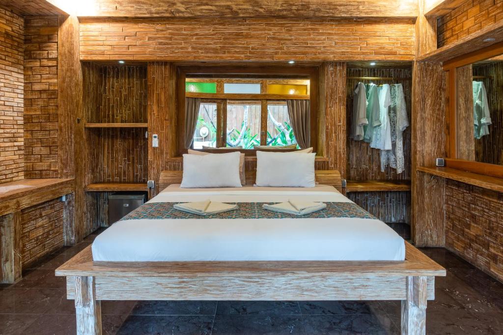 Postel nebo postele na pokoji v ubytování Jawa House Private Villas