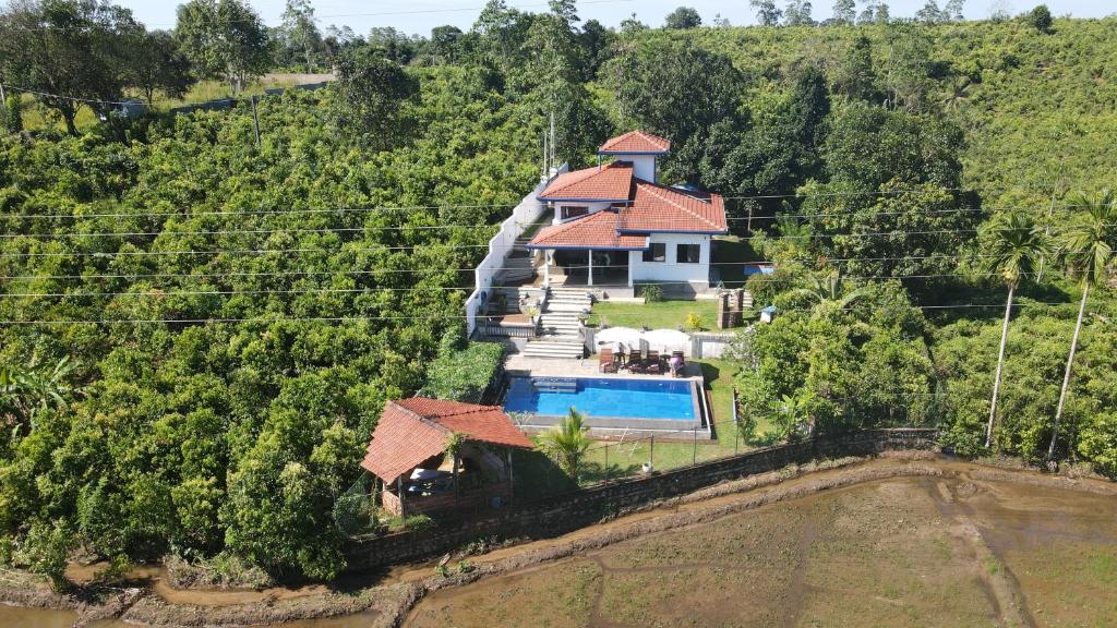 an aerial view of a house with a swimming pool at Peaceful Villa with pool near Hikkaduwa in Ambalangoda