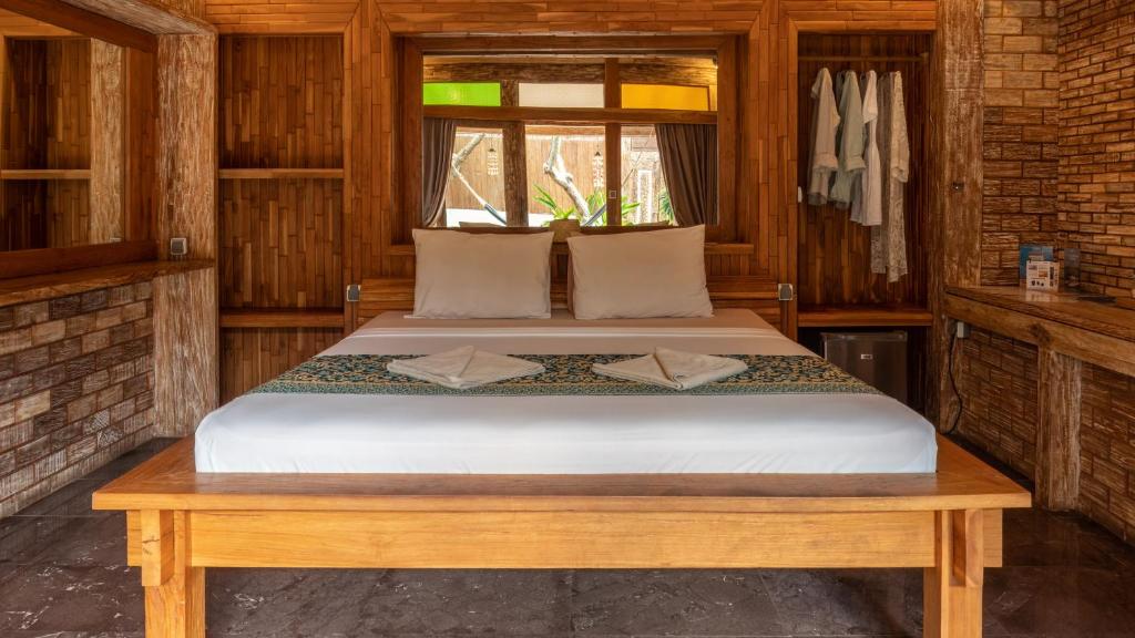 Postel nebo postele na pokoji v ubytování Jawa House Private Villas