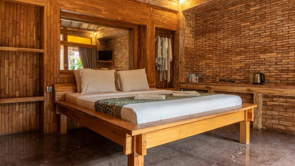 Postel nebo postele na pokoji v ubytování Jawa House Private Villas