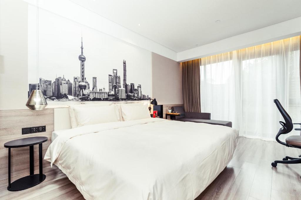 Postel nebo postele na pokoji v ubytování Atour Hotel Shanghai Pudong Airport