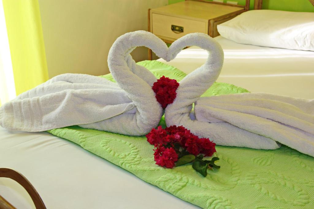 Postel nebo postele na pokoji v ubytování Coralli Rooms & Restaurant