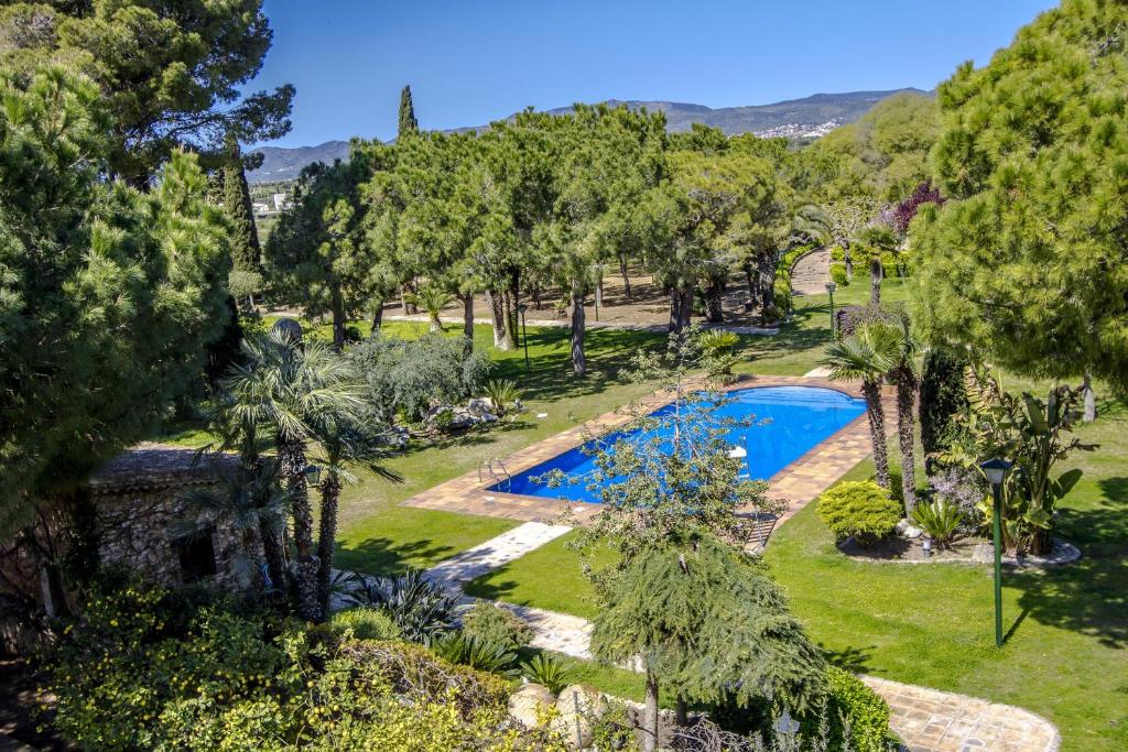 an aerial view of a garden with a swimming pool at Catalunya Casas Unique sanctuary with extra large pool! in Santa Oliva