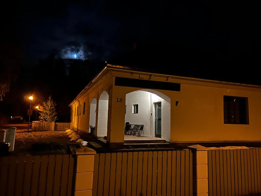 a small house at night with the moon in the sky at Võsu Pagariäri in Võsu