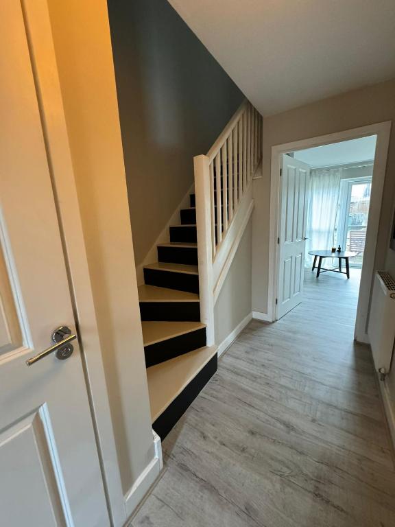 a hallway with a staircase in a house at ane in Peterborough