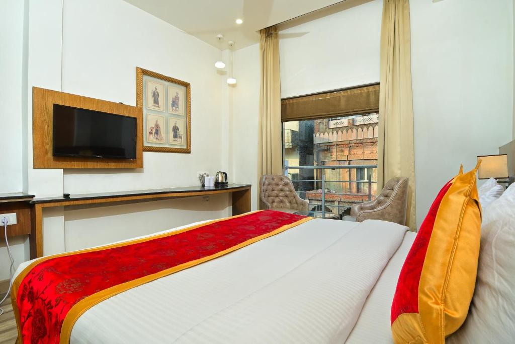 Postel nebo postele na pokoji v ubytování Hotel Hari Piorko - New Delhi Railway Station