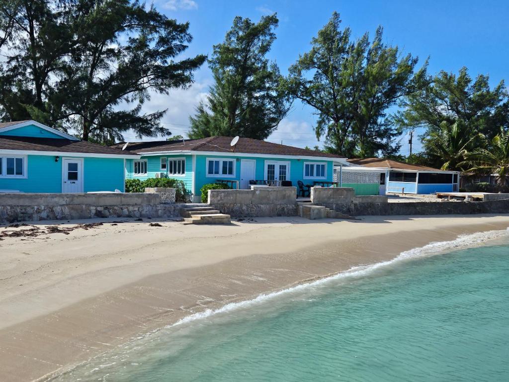 a row of blue houses on the beach at Treasures of Andros in Love Hill