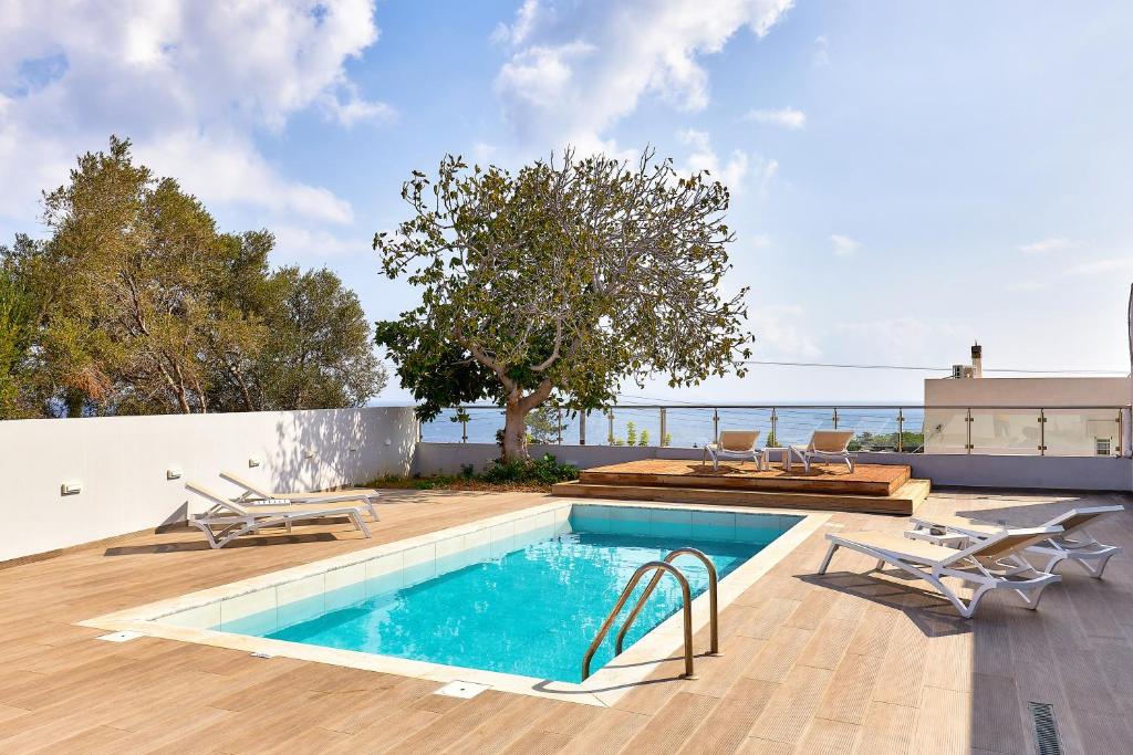 a swimming pool on top of a house at Villa Emilia - with private swimming pool in Agia Pelagia