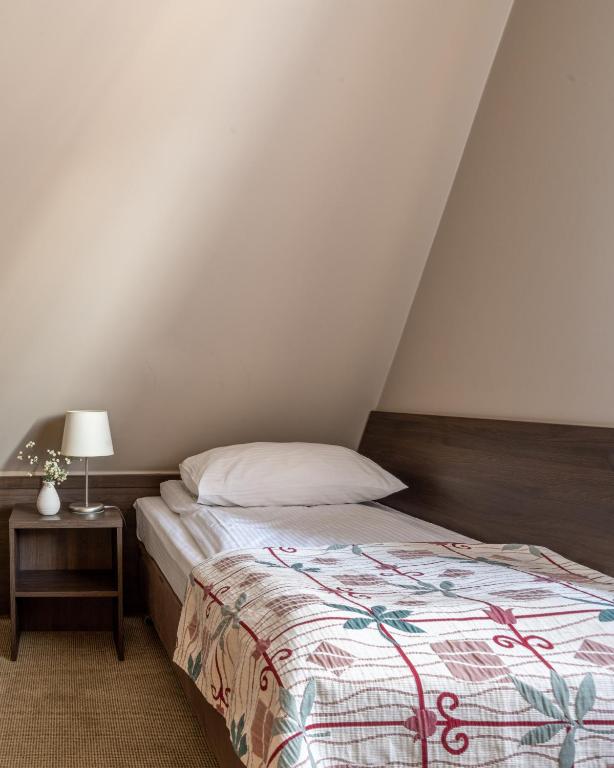 Postel nebo postele na pokoji v ubytování Dom Wczasowy Grań